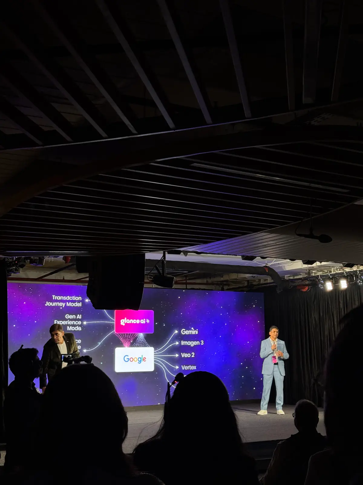 A speaker on stage at the Glance AI launch