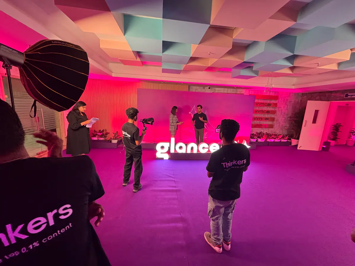 The Glance AI launch stage lit in pink