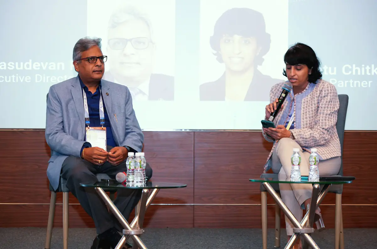 Two speakers in conversation on stage at Global Fintech Fest 2024